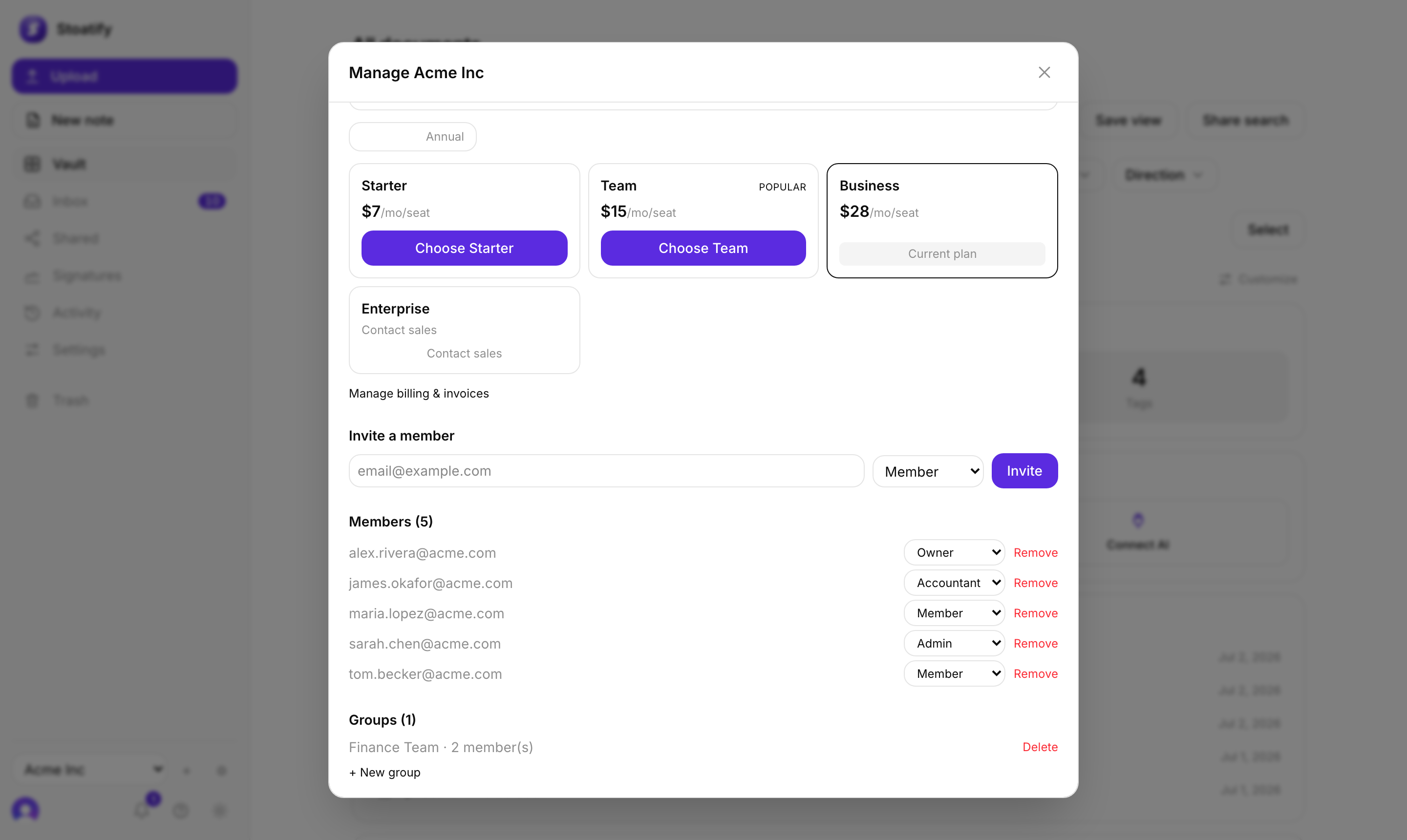 The organization management screen in Stoatify: an Invite a member field with a role dropdown, a list of members with their roles, and a groups section