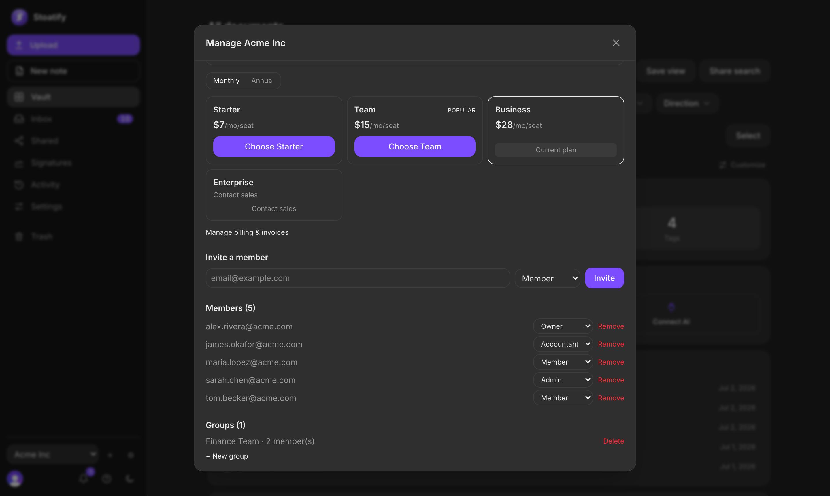 The organization management screen in Stoatify: an Invite a member field with a role dropdown, a list of members with their roles, and a groups section